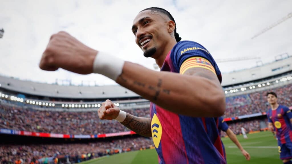 Barcelona player Raphinha celebrates scoring against Sevilla