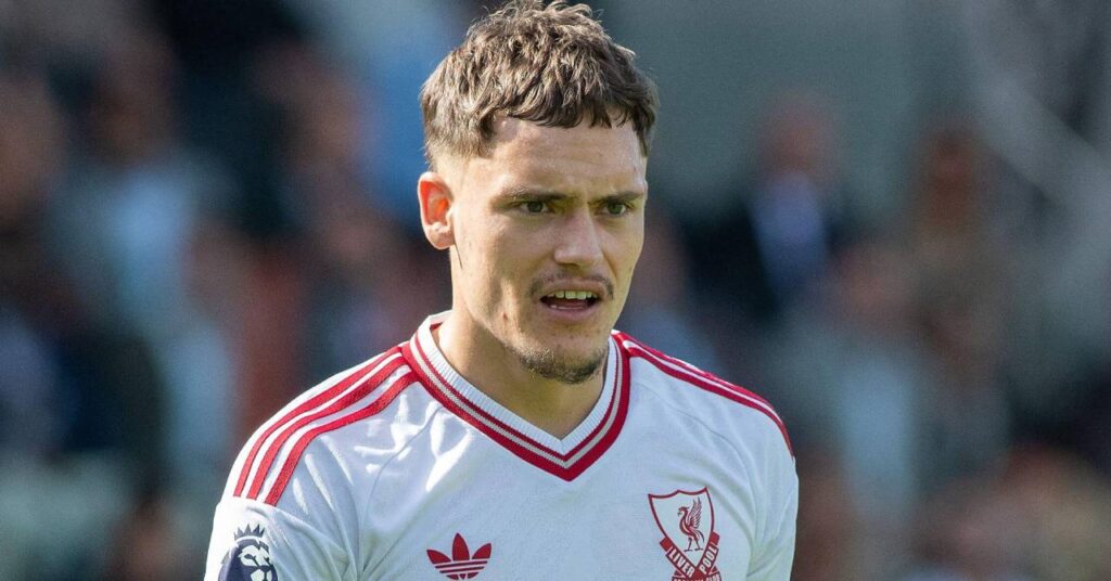 Germany footballer Florian Wirtz playing for Premier League team Liverpool Football Club in a white shirt with red trim and the Adidas logo and club liver bird badge on the chest in red